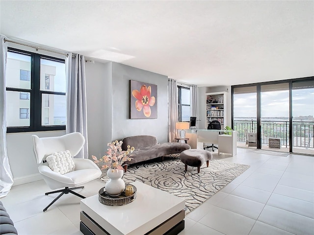 tiled living room with a wall of windows