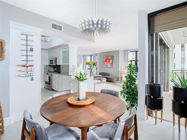 dining space featuring a notable chandelier