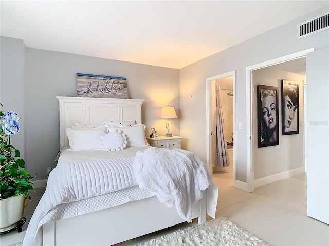 tiled bedroom with ensuite bath