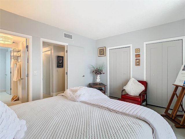 bedroom featuring two closets