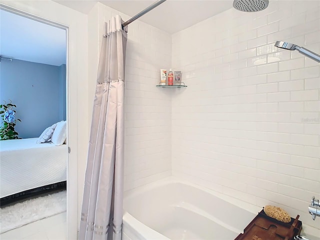 bathroom with shower / bath combo with shower curtain