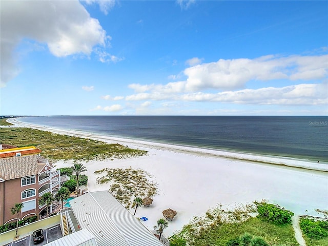 drone / aerial view featuring a beach view and a water view