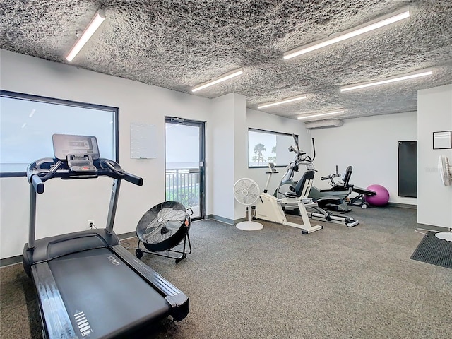 gym with a textured ceiling