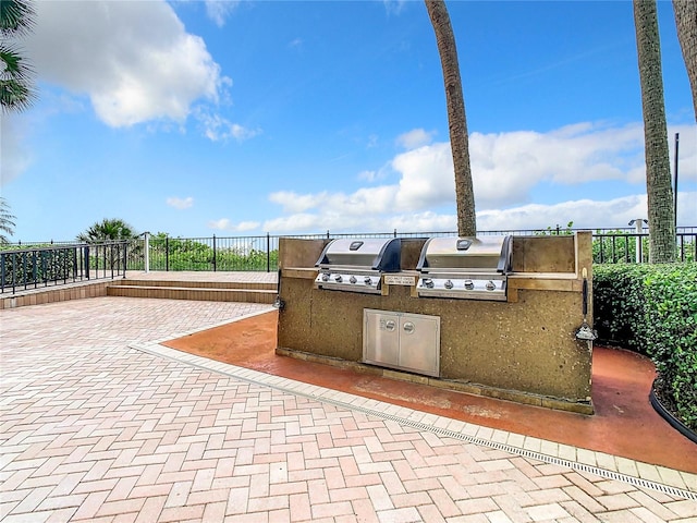 view of patio / terrace featuring an outdoor kitchen and area for grilling