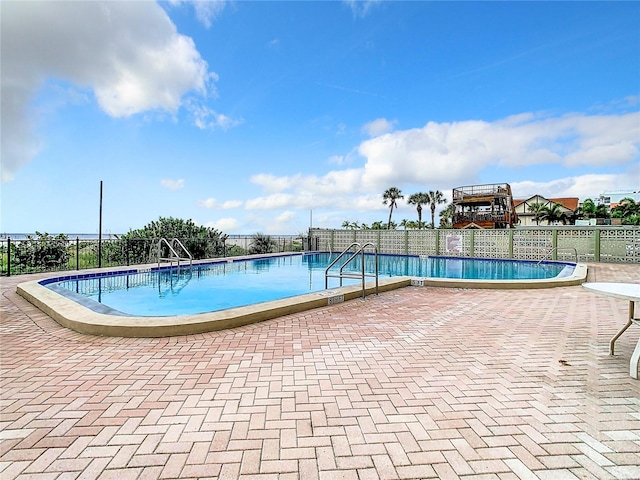 view of pool featuring a patio