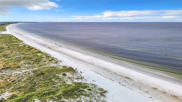 bird's eye view featuring a view of the beach and a water view