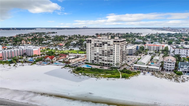 bird's eye view featuring a water view and a beach view