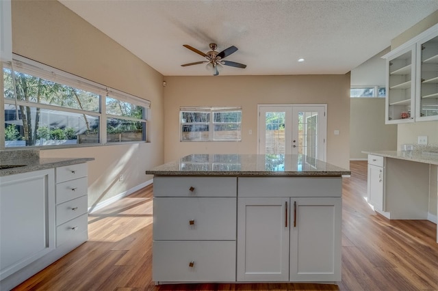 kitchen featuring white cabinetry, plenty of natural light, and light wood-type flooring