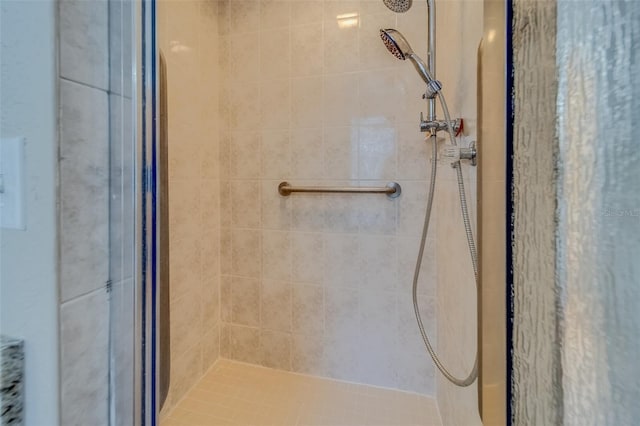 bathroom with tiled shower