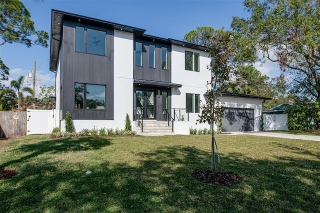 view of front facade with a front yard and a garage