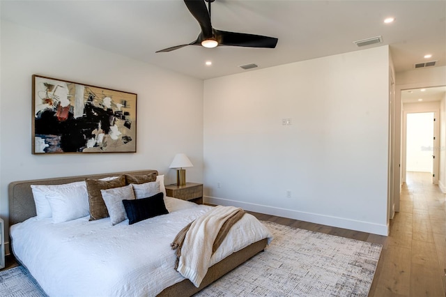 bedroom featuring ceiling fan and light hardwood / wood-style flooring