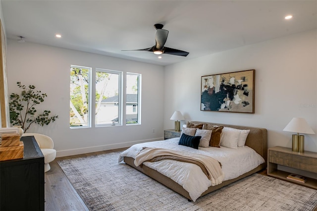 bedroom featuring wood-type flooring and ceiling fan