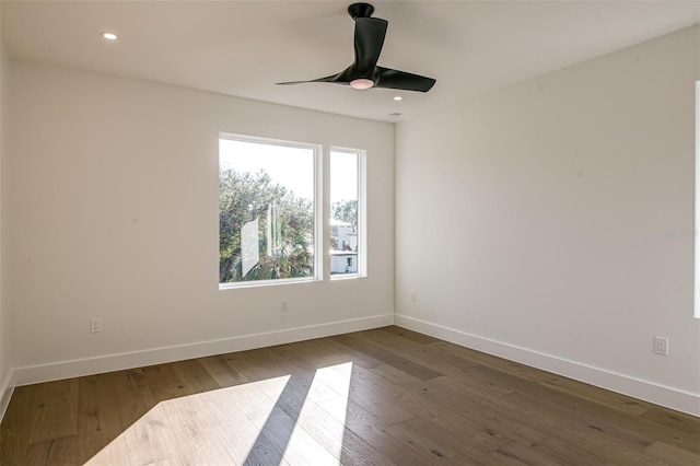 unfurnished room with hardwood / wood-style floors and ceiling fan