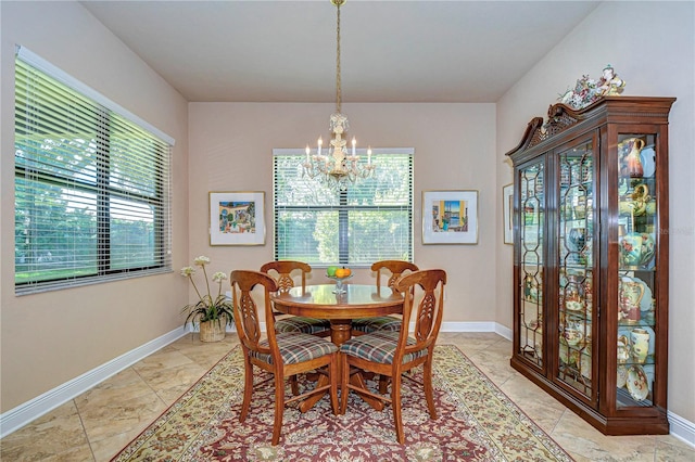 dining space featuring an inviting chandelier