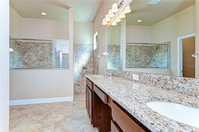 bathroom featuring vanity and a tile shower