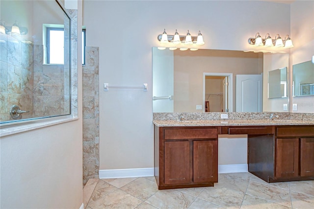 bathroom featuring vanity and tiled shower