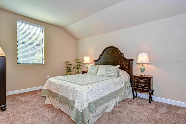 carpeted bedroom featuring lofted ceiling