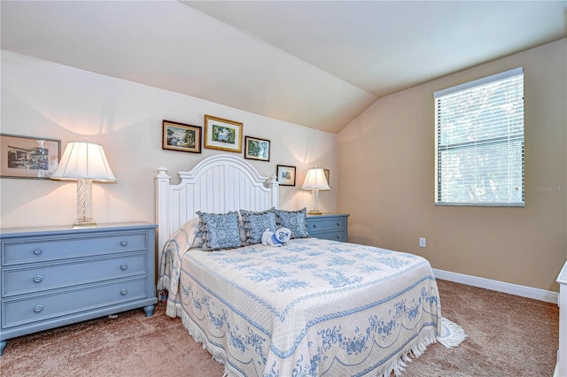 carpeted bedroom featuring vaulted ceiling