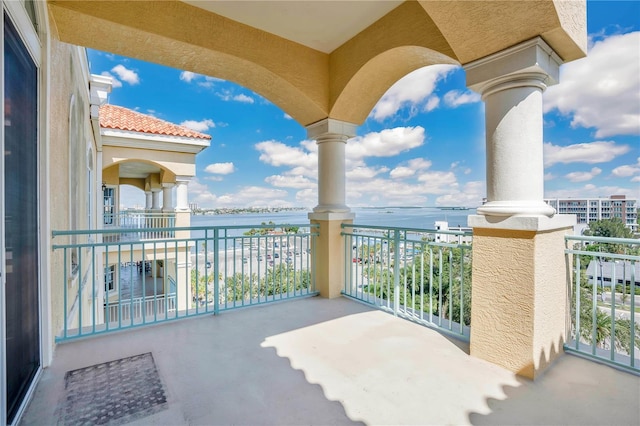 balcony featuring a water view