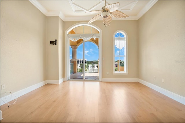 unfurnished room with ceiling fan, ornamental molding, and light hardwood / wood-style flooring