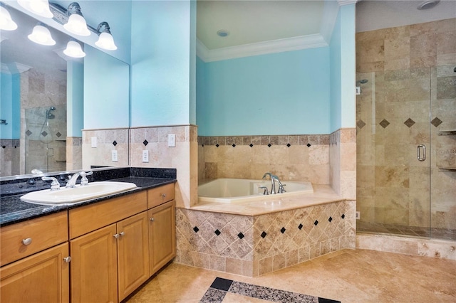 bathroom with vanity, tile walls, crown molding, and shower with separate bathtub