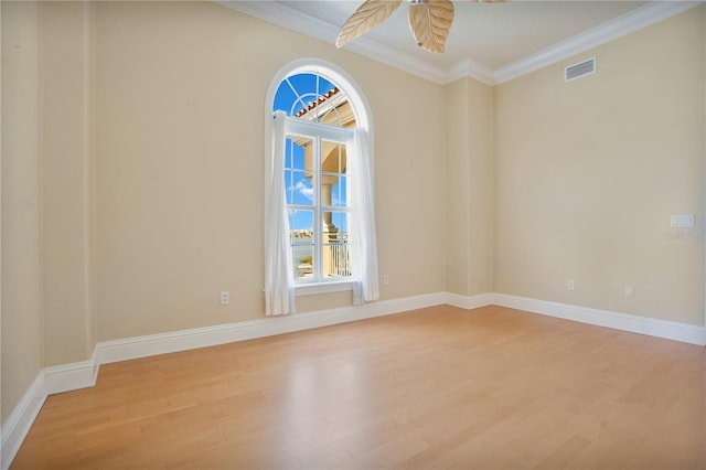 spare room with ceiling fan, light hardwood / wood-style flooring, and ornamental molding