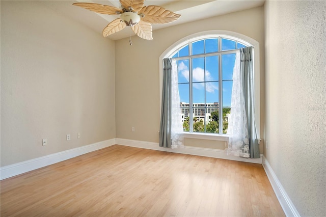 unfurnished room with ceiling fan and light hardwood / wood-style flooring