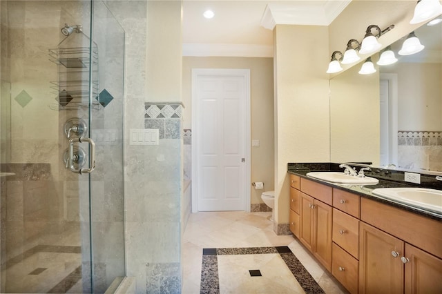 bathroom with walk in shower, vanity, toilet, and ornamental molding