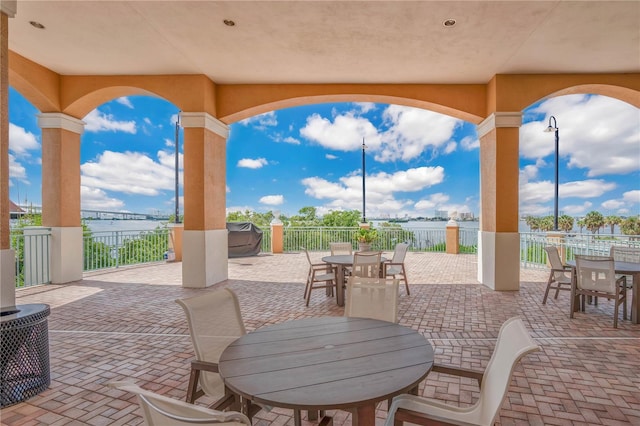 view of patio with a water view