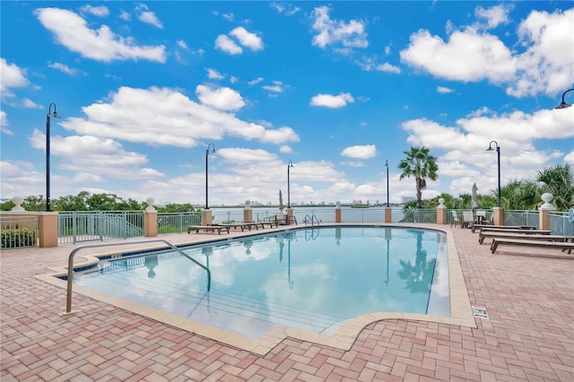 view of swimming pool with a patio