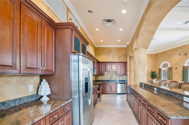 kitchen with appliances with stainless steel finishes, decorative backsplash, dark stone counters, crown molding, and sink