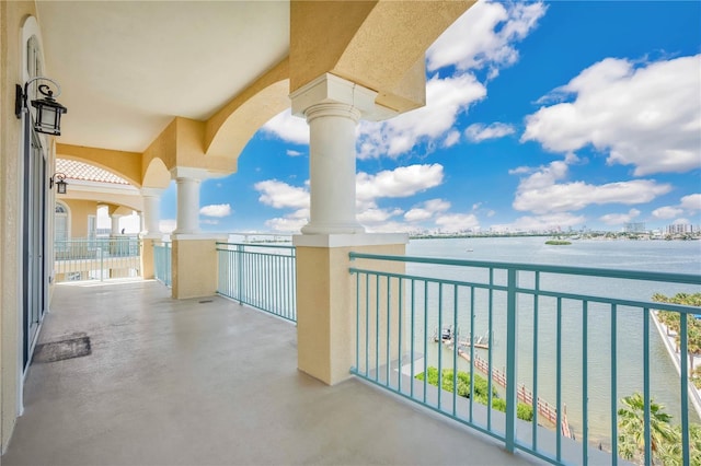 balcony featuring a water view