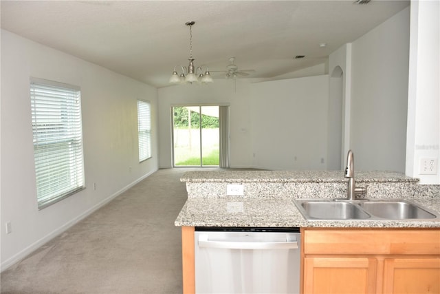 kitchen featuring light carpet, light brown cabinets, stainless steel dishwasher, ceiling fan with notable chandelier, and sink