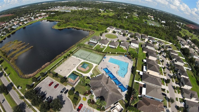 birds eye view of property with a water view