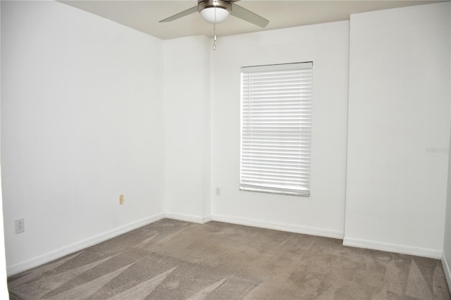 spare room with light carpet and ceiling fan