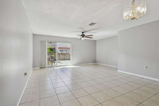 unfurnished room with light tile patterned flooring, ceiling fan, and a textured ceiling