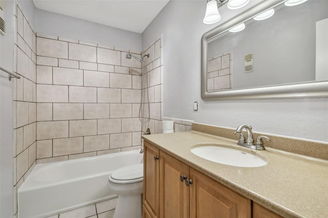 full bathroom with vanity, tiled shower / bath combo, a textured ceiling, tile patterned floors, and toilet