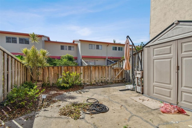 view of patio / terrace featuring a shed