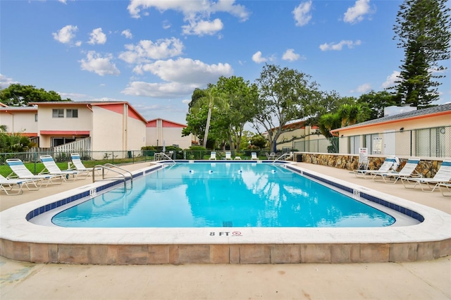 view of swimming pool featuring a patio