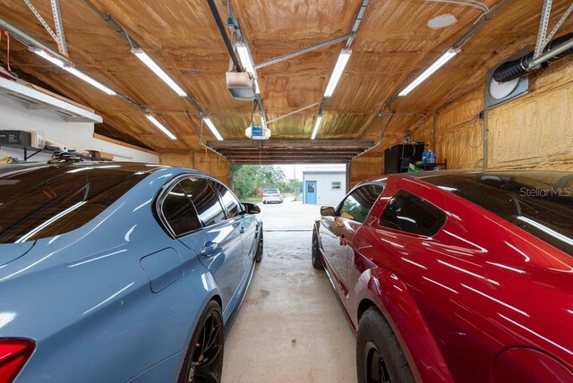 garage featuring a garage door opener