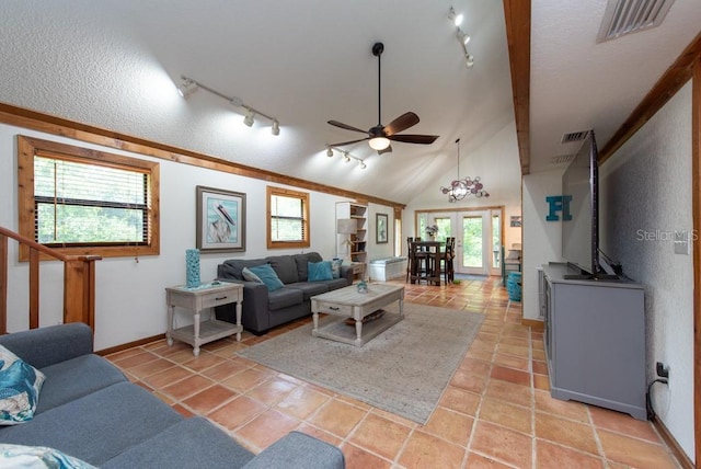 tiled living room featuring french doors, plenty of natural light, ceiling fan, and lofted ceiling