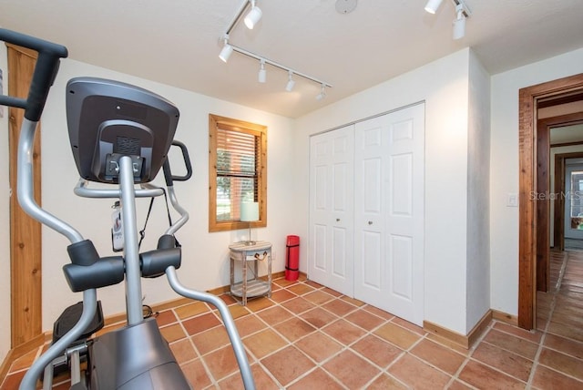 workout room featuring tile patterned flooring