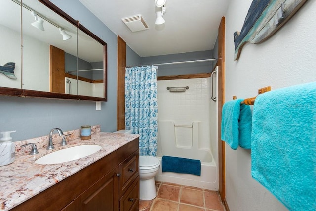 full bathroom featuring vanity, toilet, and shower / tub combo with curtain