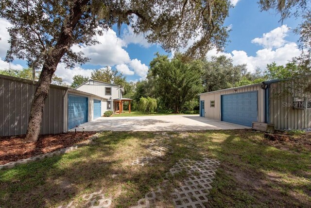 view of yard with a garage