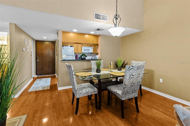 dining space featuring light hardwood / wood-style floors