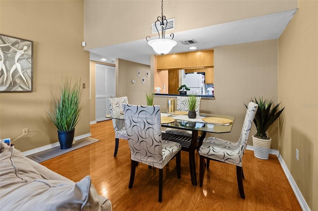 dining room with light hardwood / wood-style floors