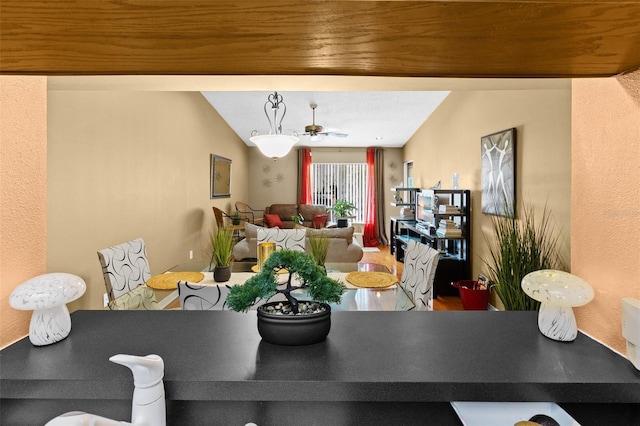 dining room with vaulted ceiling and ceiling fan