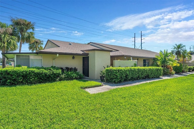 ranch-style home featuring a front yard