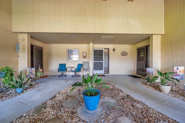 entrance to property featuring a patio