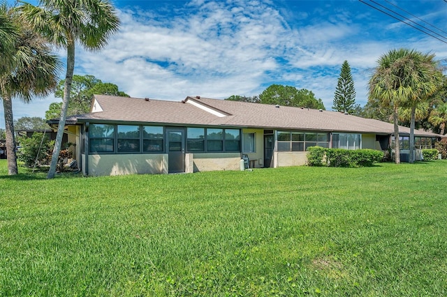 back of house with a yard